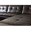 Closeup of luxurious expensive black leather couch