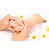 Female hands giving massage to soft bare foot