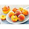 Ripe juicy peaches on a plate ready to eat