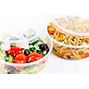 Two servings of prepared salad in plastic takeaway containers