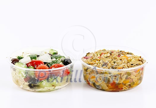 Two servings of prepared salad in plastic takeaway containers Two servings of prepared salad in plastic takeaway containers