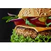Close-up of home made tasty burger ona black