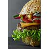 Close-up of home made tasty burger ona black