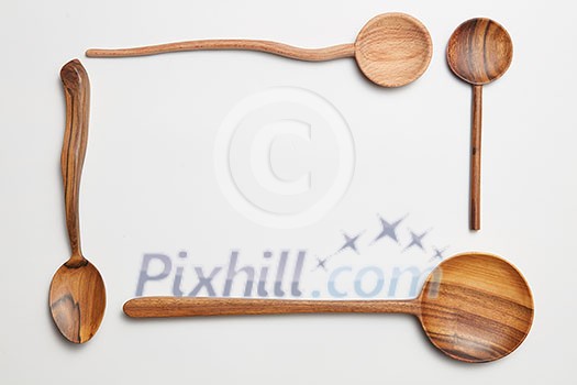 different wooden spoons isolated on white background different wooden spoons isolated on white background