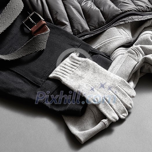 gray warm gloves winter clothes. Clothing background gray warm gloves winter clothes. Clothing background