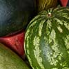 background of whole and slices of watermelon