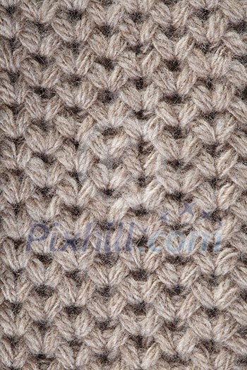 Handmade beige knitting wool texture and background Handmade beige knitting wool texture and background