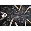 Top view of people hands drawing business teamwork strategy