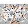 Top view of people hands drawing business teamwork strategy