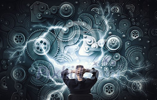Young relaxed businessman sitting in chair and looking at gears mechanism Young relaxed businessman sitting in chair and looking at gears mechanism