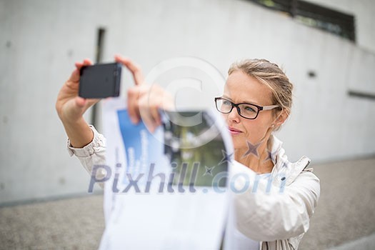 Pretty, female tourist taking a selfie picture while visiting a foreign city and its highlights landmarks, looking happy and relaxed. loving the travel (shallow DOF; color toned image) Pretty, female tourist taking a selfie picture while visiting a foreign city and its highlights landmarks, looking happy and relaxed. loving the travel (shallow DOF; color toned image)
