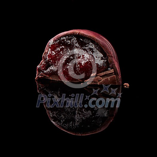 delicious Chocolate candy in a cut isolated on a black background delicious Chocolate candy in a cut isolated on a black background