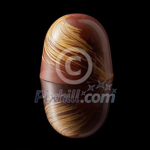 Chocolate colored candy isolated on a black background Chocolate colored candy isolated on a black background