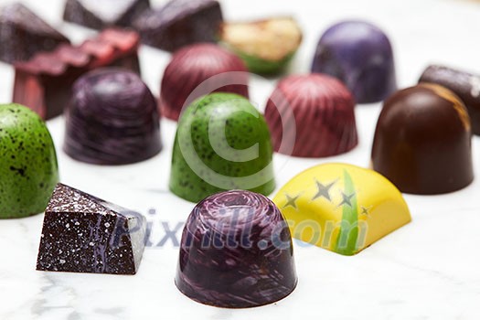 Luxury chocolate candies on a white marble background. Luxury chocolate candies on a white marble background.