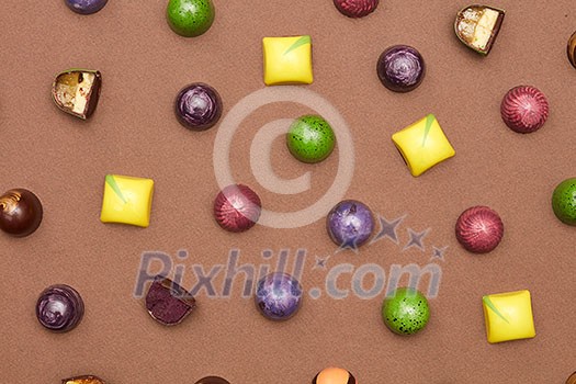 Colorful pattern made of chocolates. Flat lay. Food background. Colorful pattern made of chocolates. Flat lay. Food background.