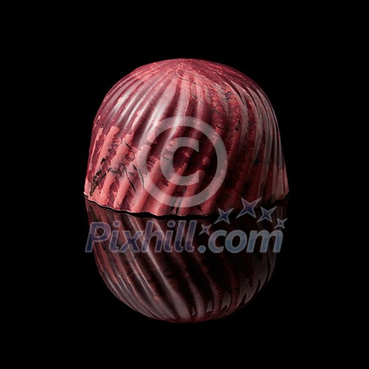 delicious red chocolate candy on a black background delicious red chocolate candy on a black background