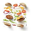 Two burgers with flying ingredients isolated on white background