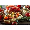 Bruschetta set . Black wood background, top view, horizontal composition