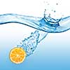 Orange falling into the water isolated on a blue background.