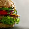 home made tasty burgers isolated on gray background