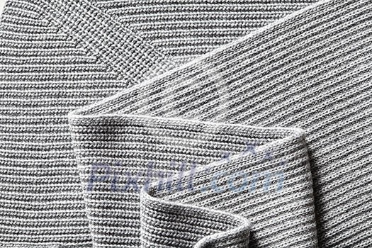 Closeup macro texture of knitted cotton fabric, clothing background with folds Closeup macro texture of knitted cotton fabric, clothing background with folds