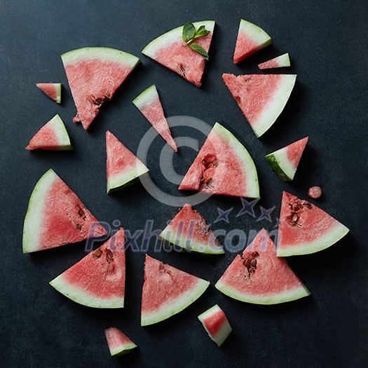 Background of fresh ripe watermelon slices on black Background of fresh ripe watermelon slices on black