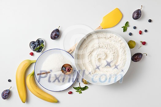 ingredients for the banana cake with berries on white background ingredients for the banana cake with berries on white background