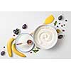 ingredients for the banana cake with berries on white background