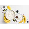 the ingredients for the banana cake with plums on white background