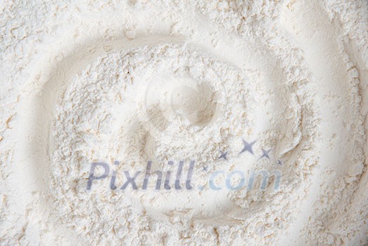 Surface covered with the wheat flour as a background Surface covered with the wheat flour as a background