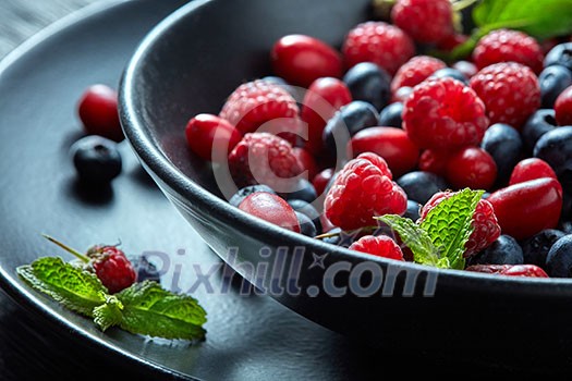 Fresh berries in the bowl. Raspberries and blue-berries, dessert, fresh berries close-up. healthy eating, food. Fresh berries in the bowl. Raspberries and blue-berries, dessert, fresh berries close-up. healthy eating, food.