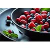 Fresh berries in the bowl. Raspberries and blue-berries, dessert, fresh berries close-up. healthy eating, food.