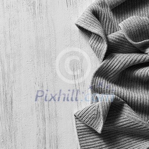 Christmas holidays at home Cosy soft winter background, knitted sweater on old vintage wooden board. place for text, Top view flat lay with copy space for slogan or text message Christmas holidays at home Cosy soft winter background, knitted sweater on old vintage wooden board. place for text, Top view flat lay with copy space for slogan or text message