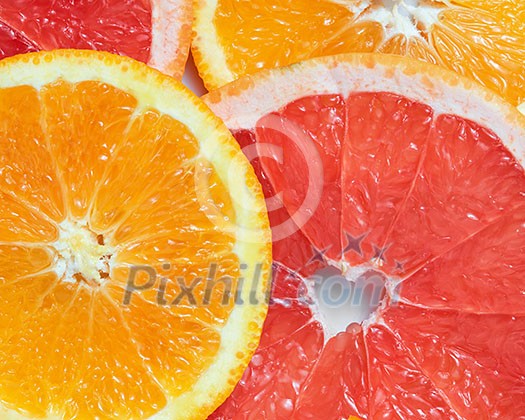 Mix fresh sliced orange, lemon and grapefruit on white background Mix fresh sliced orange, lemon and grapefruit on white background