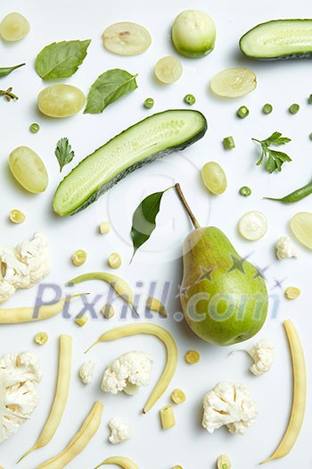 Close up of green vegetables and fruits on background. Healthy eating and food for vegans Close up of green vegetables and fruits on background. Healthy eating and food for vegans