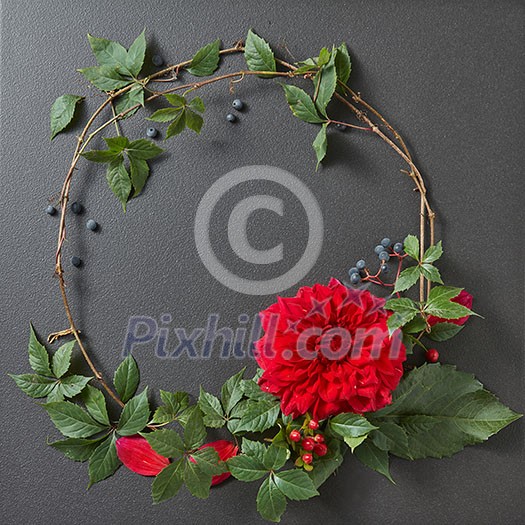 round frame of branches and flower and copycpase for text on black background round frame of branches and flower and copycpase for text on black background