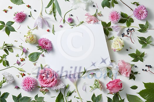 pattern flowers with empty white notebook on a white background, copy space for your text or design pattern flowers with empty white notebook on a white background, copy space for your text or design