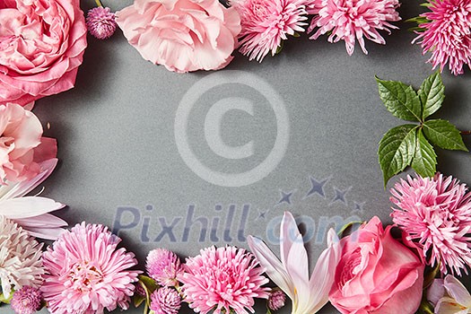 Beautiful pink flowers frame on black background Beautiful pink flowers frame on black background