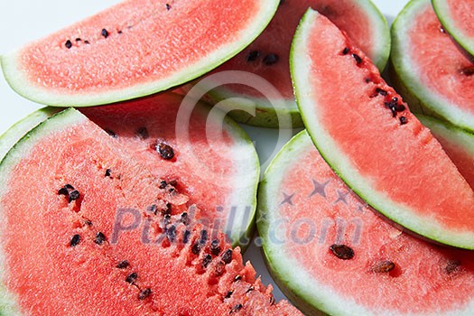 Background of red fresh watermelon slices, close up Background of red fresh watermelon slices, close up