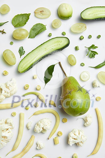 Close up of green vegetables and fruits on background. Healthy eating and food for vegans Close up of green vegetables and fruits on background. Healthy eating and food for vegans