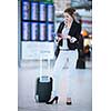 Pretty young female passenger at the airport (shallow DOF; color toned image)