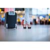 Pretty young female passenger at the airport (shallow DOF; color toned image)