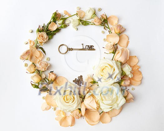 round frame of roses in the middle of the key to the heart, Valentine's concept. round frame of roses in the middle of the key to the heart, Valentine's concept.
