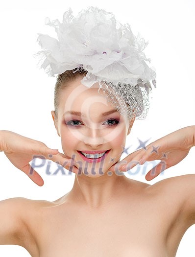 Beautiful smiling girl in a wedding hat over white background Beautiful smiling girl in a wedding hat over white background