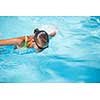 Pretty female swimmer in a pool, getting her daily dose of exercise without stressing her joints