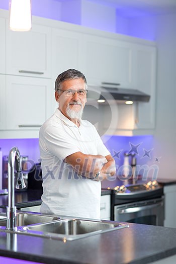 Senior man standing in his renovated, modern kitchen, Senior man standing in his renovated, modern kitchen,