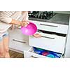 Young woman in her lovely, modern kitchen