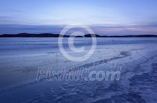 Frozen lake scenery in march