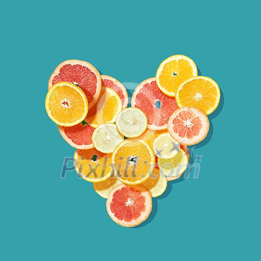 Fresh fruits heart on blue background. Valentine postcard Fresh fruits heart on blue background. Valentine postcard