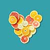 Fresh fruits heart on blue background. Valentine postcard